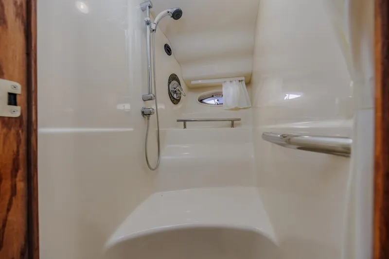 Hideout Yacht Photos Pics 2005 Sea Ray 390 Sundancer shower interior with sleek design and modern fixtures.