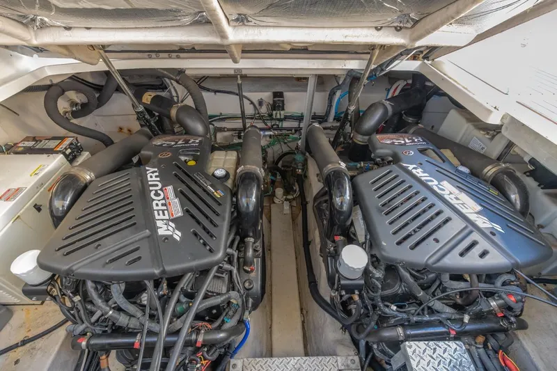 Hideout Yacht Photos Pics Engine room of 2005 Sea Ray 390 Sundancer with twin Mercury engines.