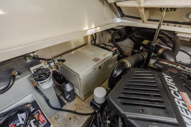 Hideout Yacht Photos Pics Engine compartment of 2005 Sea Ray 390 Sundancer with Mercury components and equipment.