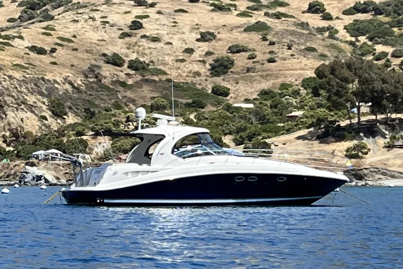 Hideout Yacht Photos Pics 2005 Sea Ray 390 Sundancer yacht anchored in scenic coastal waters.