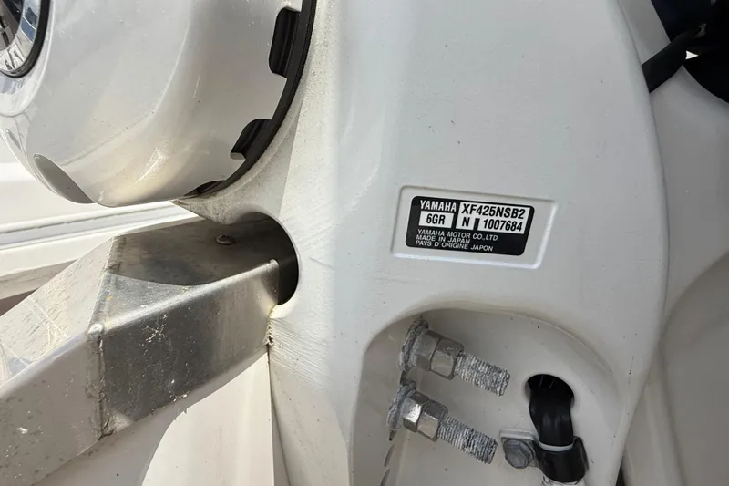  Yacht Photos Pics Close-up of a 2022 Regal 36 XO boat's Yamaha motor label and mounting details.