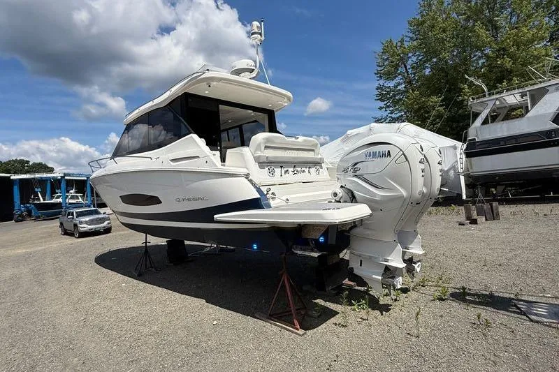  Yacht Photos Pics 2022 Regal 36 XO boat with Yamaha engines on a sunny day.