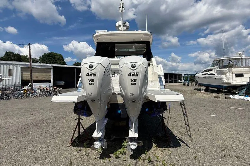  Yacht Photos Pics 2022 Regal 36 XO boat with twin 425 V8 engines, docked outdoors.