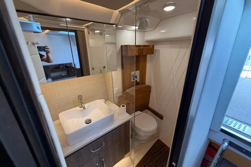  Yacht Photos Pics Modern bathroom in 2022 Regal 36 XO yacht with sleek sink and shower.