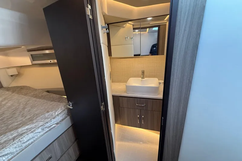  Yacht Photos Pics 2022 Regal 36 XO yacht interior with modern bathroom and cozy bedroom.