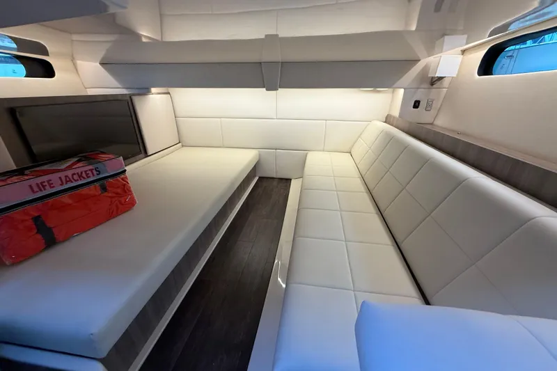  Yacht Photos Pics Interior of 2022 Regal 36 XO yacht with white seating and life jackets.