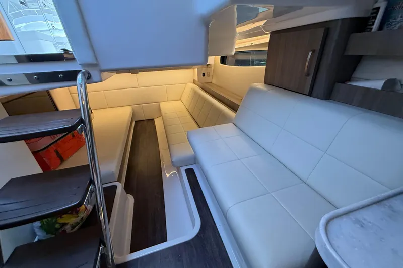  Yacht Photos Pics Interior of 2022 Regal 36 XO yacht with white seating and modern design.