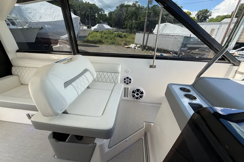  Yacht Photos Pics Interior of 2022 Regal 36 XO yacht with white seating and modern design.