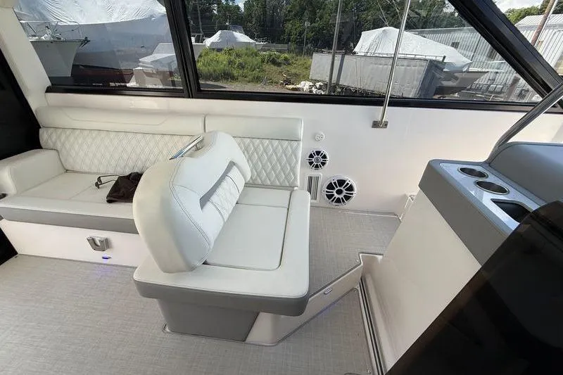  Yacht Photos Pics Interior of 2022 Regal 36 XO yacht with white seating and cup holders.