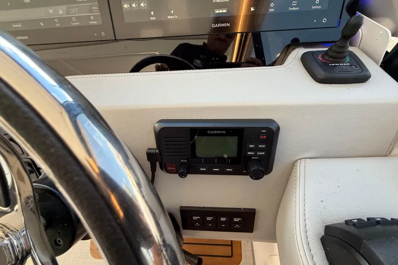  Yacht Photos Pics 2022 Regal 36 XO boat dashboard with Garmin navigation system and controls.