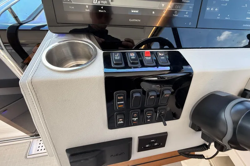  Yacht Photos Pics Control panel of 2022 Regal 36 XO boat with Garmin display and cup holder.