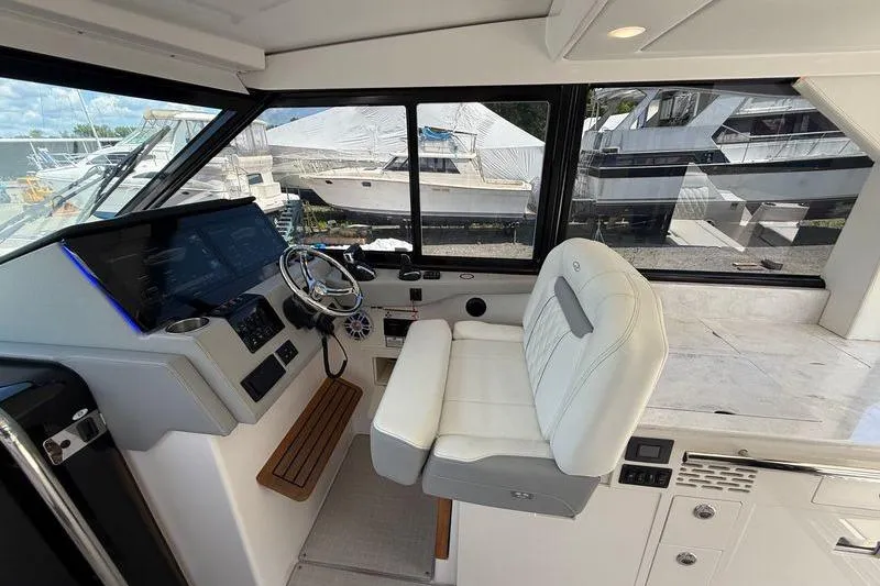  Yacht Photos Pics 2022 Regal 36 XO yacht cockpit with modern helm and luxurious seating.