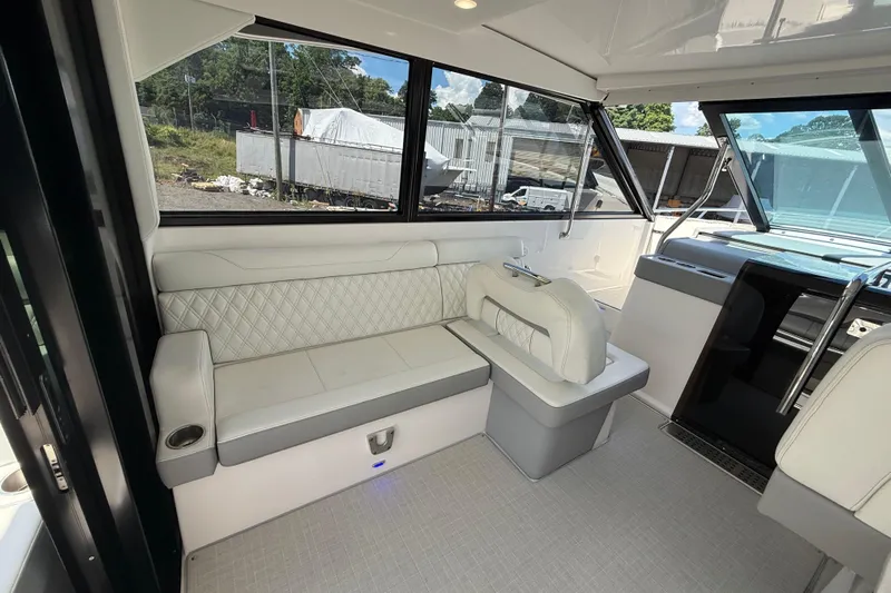  Yacht Photos Pics Luxurious interior of 2022 Regal 36 XO yacht with elegant seating and modern design.