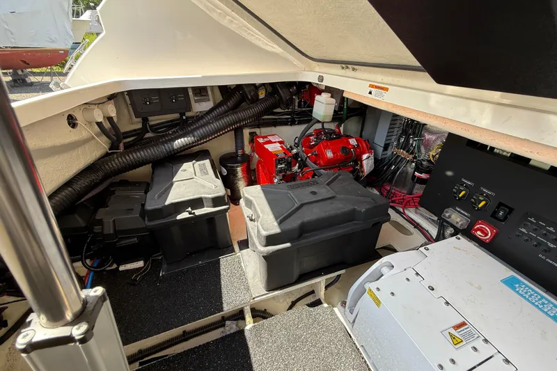  Yacht Photos Pics Engine compartment of 2022 Regal 36 XO boat, showcasing batteries and electrical components.