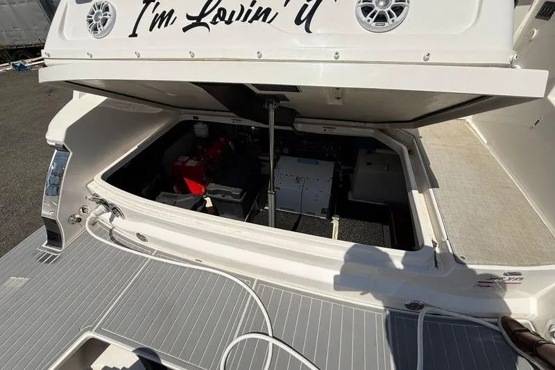  Yacht Photos Pics 2022 Regal 36 XO yacht engine compartment with open hatch, showcasing interior components.