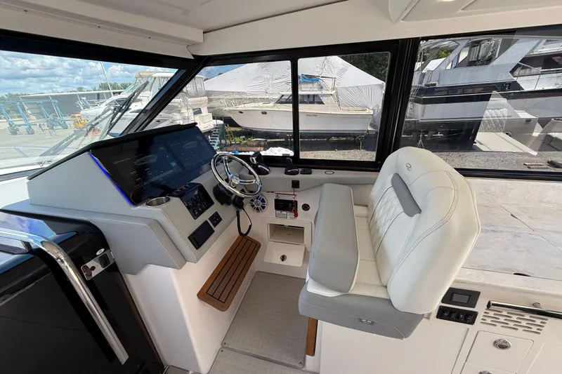  Yacht Photos Pics Interior of 2022 Regal 36 XO boat with modern helm and luxurious seating.