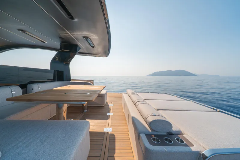  Yacht Photos Pics Luxurious Invictus TT550 yacht interior, 2025 model, with elegant seating and ocean view.