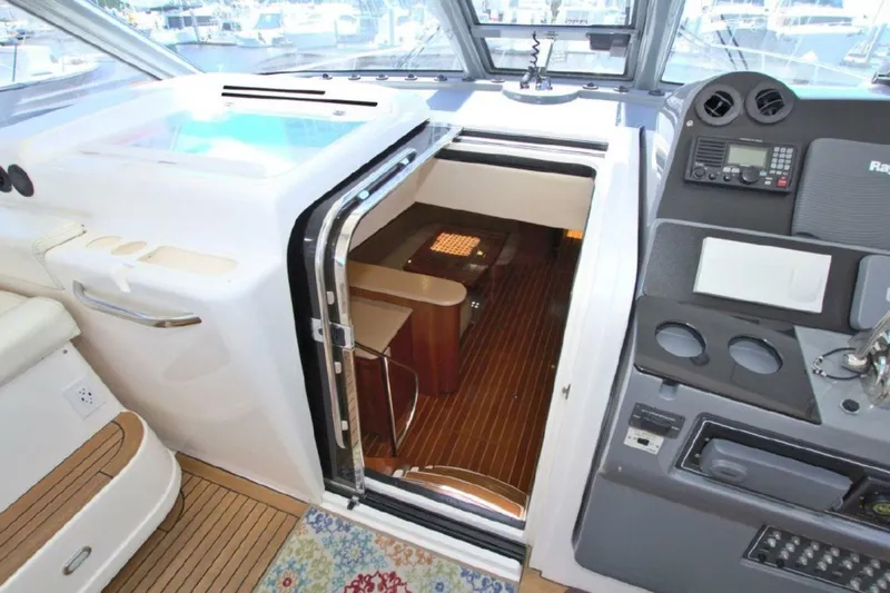 Sunshine Yacht Photos Pics 2000 Tiara Yachts 5200 Express interior with helm and cabin entrance.