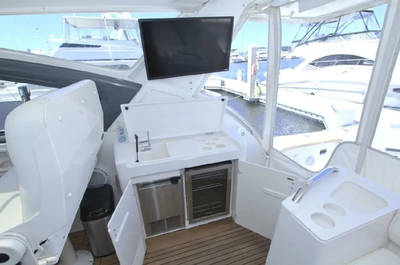 Sunshine Yacht Photos Pics Tiara Yachts 5200 Express 2000 model with outdoor kitchenette and marina view.