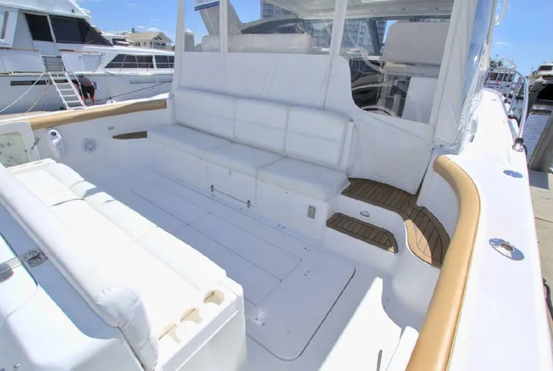 Sunshine Yacht Photos Pics 2000 Tiara Yachts 5200 Express with spacious white seating and wooden accents.