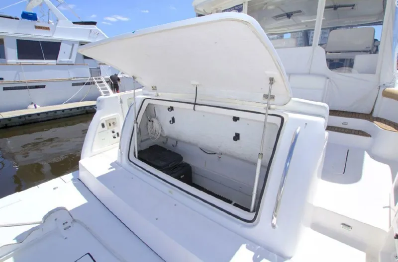 Sunshine Yacht Photos Pics Open storage compartment on 2000 Tiara Yachts 5200 Express boat deck.