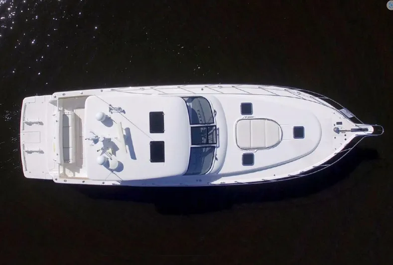 Sunshine Yacht Photos Pics Aerial view of 2000 Tiara Yachts 5200 Express boat on dark water.