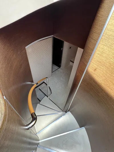  Yacht Photos Pics Staircase inside 2006 Azimut 86S yacht, featuring sleek wooden design and modern handrail.