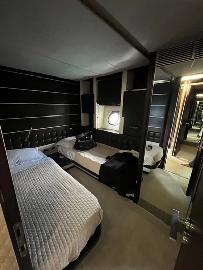  Yacht Photos Pics Luxurious 2006 Azimut 86S yacht bedroom with twin beds and modern decor.