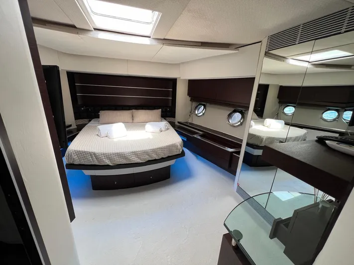  Yacht Photos Pics Luxurious bedroom interior of 2006 Azimut 86S yacht with modern design and skylight.