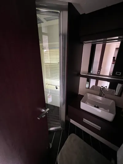  Yacht Photos Pics Luxurious bathroom interior of 2006 Azimut 86S yacht with modern sink and shower.