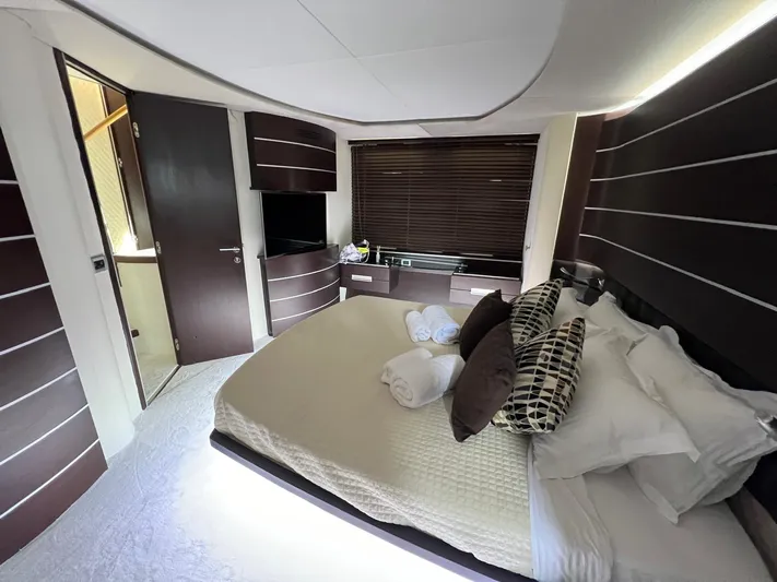  Yacht Photos Pics Luxurious bedroom interior of 2006 Azimut 86S yacht with modern decor and comfortable bedding.