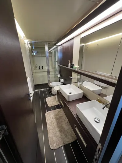  Yacht Photos Pics Luxurious bathroom in 2006 Azimut 86S yacht with modern fixtures and dual sinks.