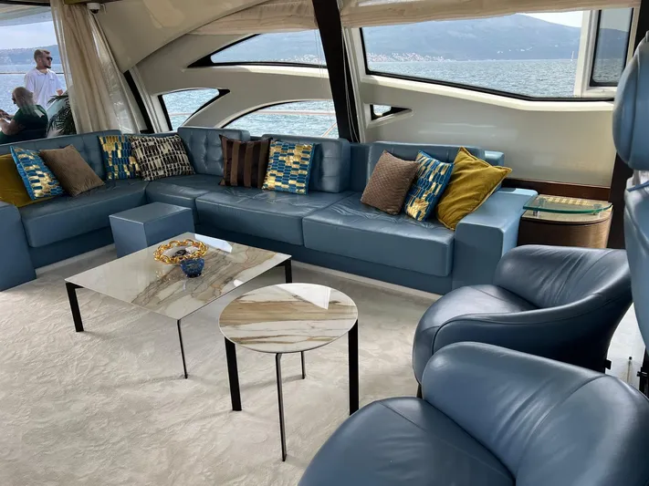  Yacht Photos Pics Luxurious 2006 Azimut 86S yacht interior with blue leather seating and modern decor.