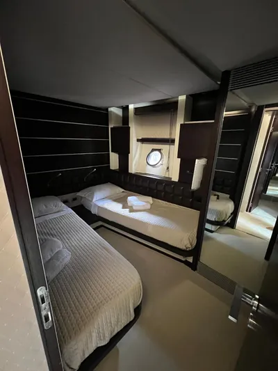  Yacht Photos Pics Luxurious cabin interior of 2006 Azimut 86S yacht with twin beds and modern decor.