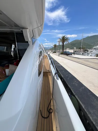  Yacht Photos Pics Side view of 2006 Azimut 86S yacht docked at marina under blue sky.