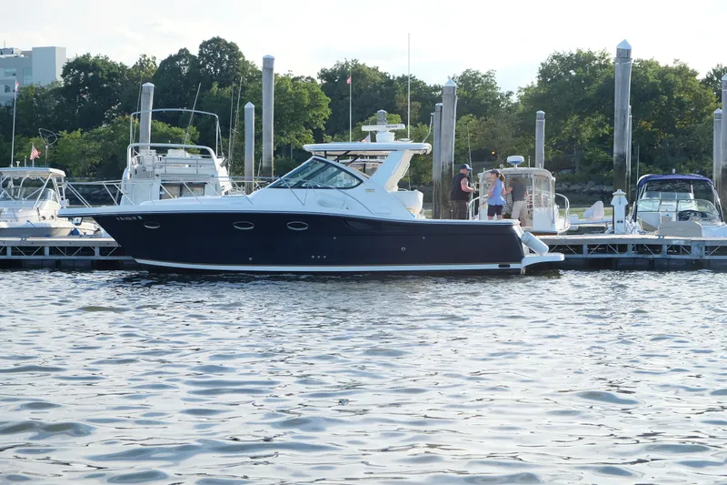  Yacht Photos Pics 2006 Tiara Yachts 3200 Open docked at marina, surrounded by other boats.