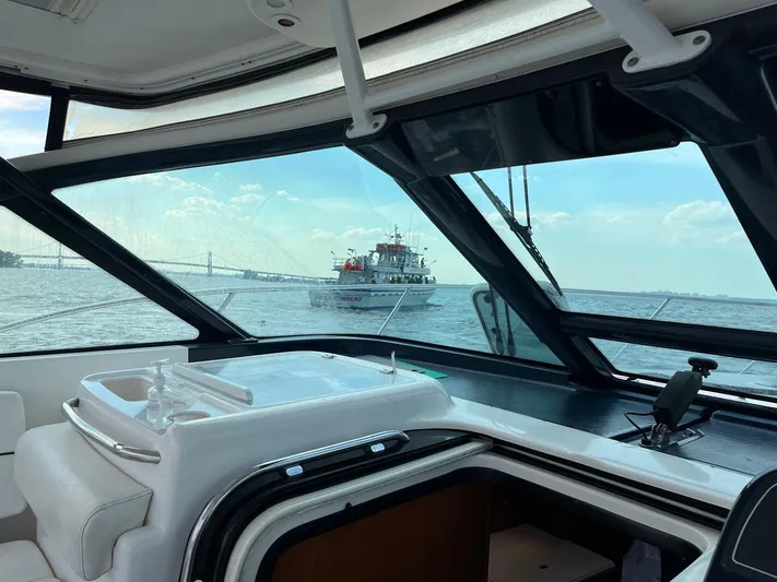  Yacht Photos Pics 2006 Tiara Yachts 3200 Open interior view with ocean and boat in background.