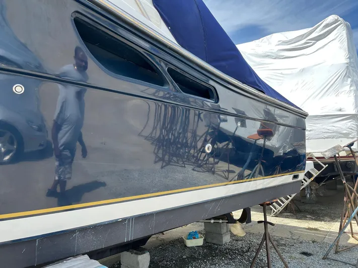  Yacht Photos Pics 2006 Tiara Yachts 3200 Open with polished hull, docked and covered.