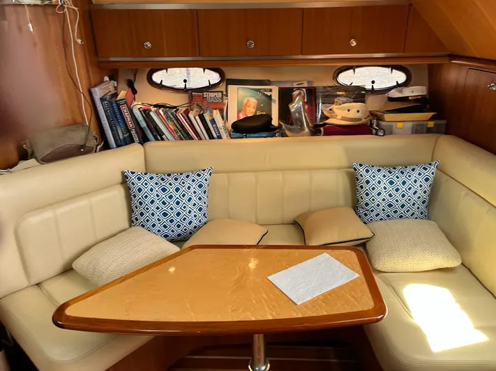  Yacht Photos Pics Cozy interior of 2006 Tiara Yachts 3200 Open with books and cushions.