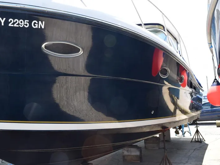  Yacht Photos Pics 2006 Tiara Yachts 3200 Open, dark blue hull, docked on stands.