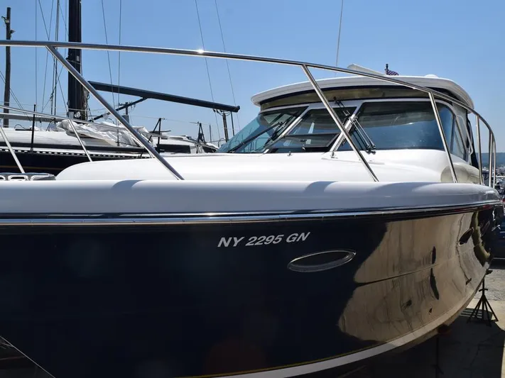  Yacht Photos Pics 2006 Tiara Yachts 3200 Open boat docked, featuring sleek design and registration number NY 2295 GN.