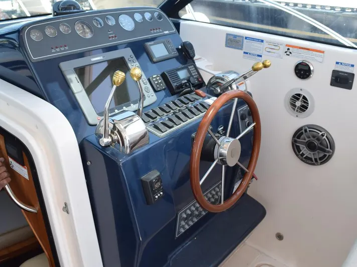  Yacht Photos Pics 2006 Tiara Yachts 3200 Open helm with controls, gauges, and steering wheel.