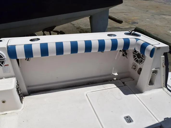  Yacht Photos Pics 2006 Tiara Yachts 3200 Open cockpit with blue and white striped padding.