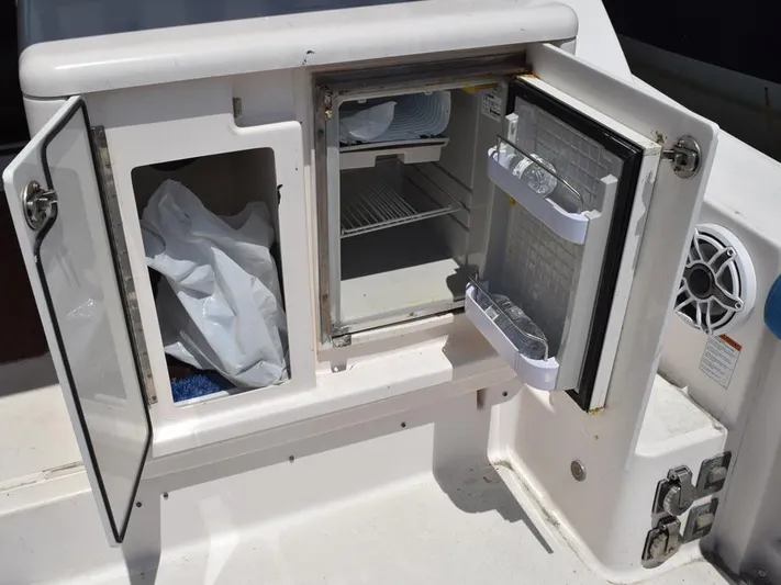  Yacht Photos Pics Open storage and mini fridge on 2006 Tiara Yachts 3200 Open boat.