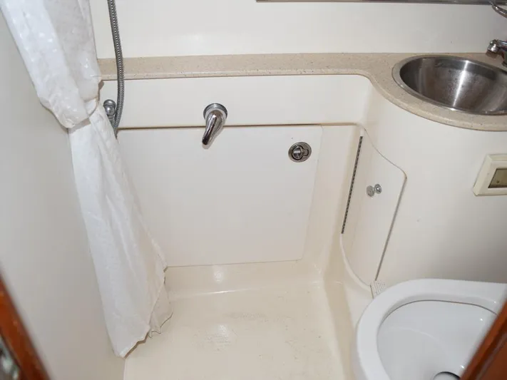  Yacht Photos Pics 2006 Tiara Yachts 3200 Open bathroom with shower, sink, and toilet.