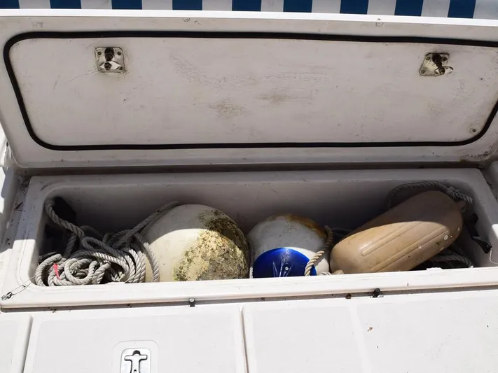  Yacht Photos Pics Storage compartment on a 2006 Tiara Yachts 3200 Open, containing ropes and buoys.