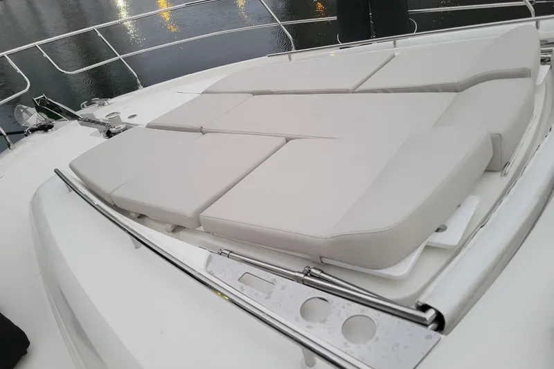 Elles II Yacht Photos Pics Luxurious sunbathing area on 2018 Prestige 520 yacht, featuring comfortable cushions.