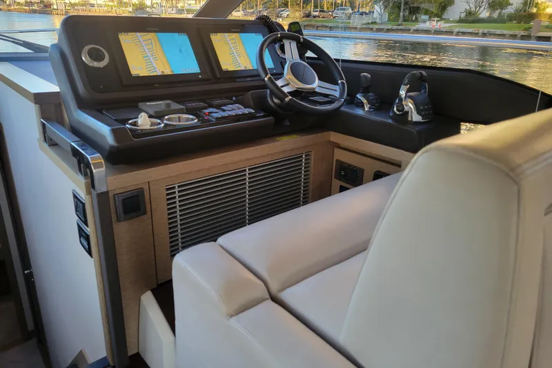 Elles II Yacht Photos Pics Interior helm of 2018 Prestige 520 yacht with modern navigation controls.