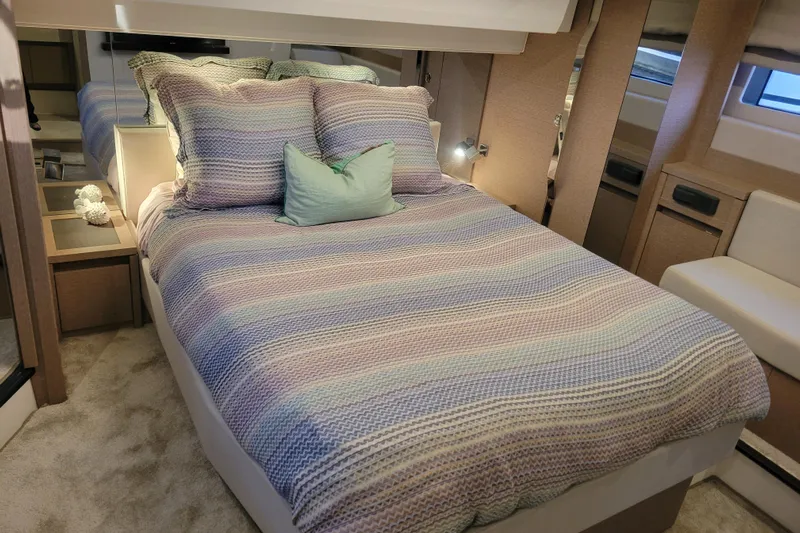 Elles II Yacht Photos Pics Luxurious bedroom interior of 2018 Prestige 520 yacht with cozy bedding.