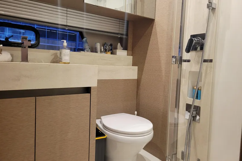 Elles II Yacht Photos Pics Luxurious bathroom in a 2018 Prestige 520 yacht, featuring modern fixtures and elegant design.